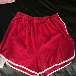 red & white athletic shorts.